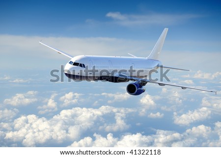 ストックフォト: Wings Of An Aircraft In The Blue Clear Sky