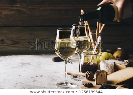 ストックフォト: Glass Of White Wine And Assorted Cheese