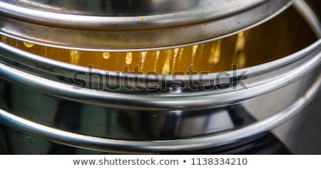Stock foto: Strain The Poured Honey Through A Sieve How To Harvest Honey Filtering Raw Honey