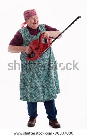 Stok fotoğraf: Senior Gardener With Hedge Trimmer At Garden