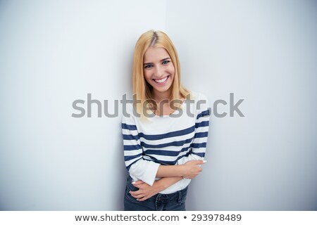 Сток-фото: Young Blonde Businesswoman Stands With Crossed Hands