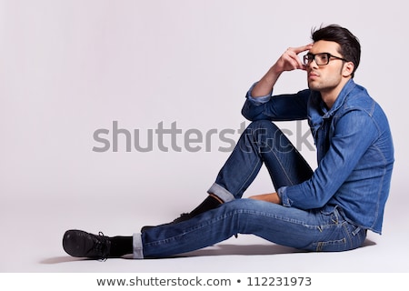 Stockfoto: Side View Of A Pensive Young Man With Glasses