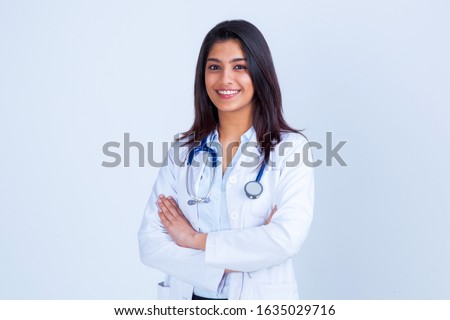 Stock fotó: A Female Doctor Looking At A Young Girl