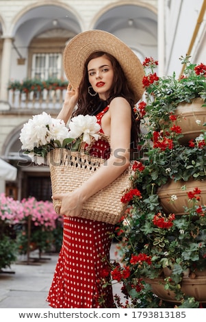 Stok fotoğraf: Beautiful Young Woman In Red Polka Dots Dress Holding Basket Wit
