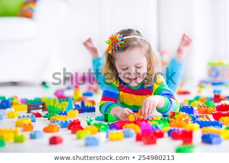 Stock photo: Happy Baby Girl Playing With Toy Blocks At Home