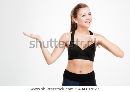 Сток-фото: Pretty Fitness Woman Pointing To Copyspace