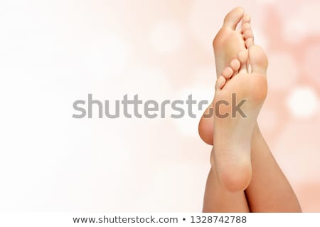 Stockfoto: Legs Of A Woman Against Abstract Pastel Background