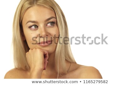 [[stock_photo]]: Smiling Woman Placing Her Hand On Her Forehead And Standing In Front Of The Sea