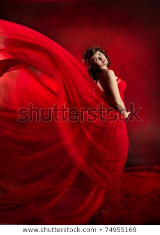 Foto stock: Smiling Woman Standing A Red Evening Gown
