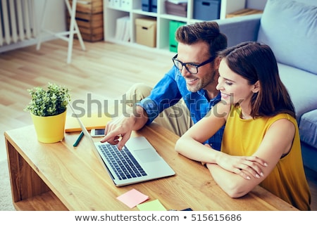 ストックフォト: Smiling Young Couple Shopping On Laptop