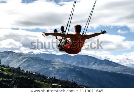 Zdjęcia stock: Girl Swinging On Swing Over Natural Background