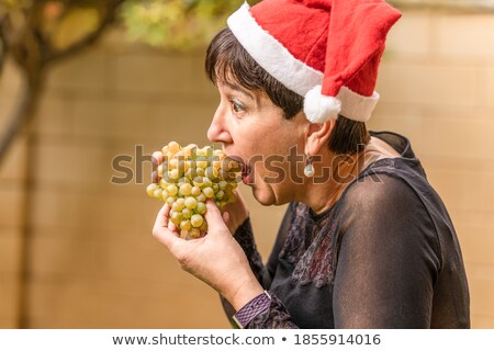 Stock photo: Blonde Woman Showing Grapes