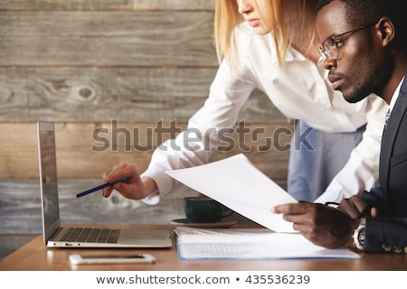 Stockfoto: Portrait Two Men Looking At Plans