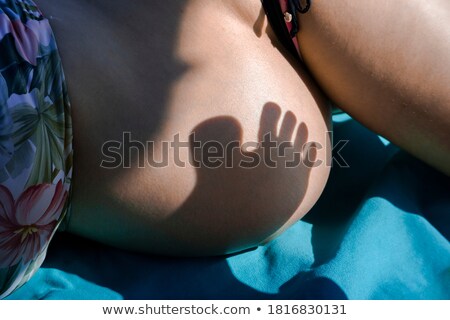 [[stock_photo]]: Female Belly Bikini And Shades