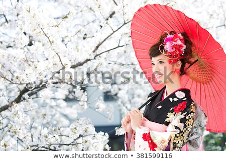 Foto stock: Asian Woman In Traditional Japanese Kimono Outdoors