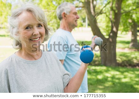 Zdjęcia stock: Senior Couple Standing Side By Side On A Meadow