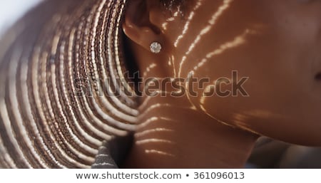 [[stock_photo]]: Close Up Of African Woman Ear With Earring