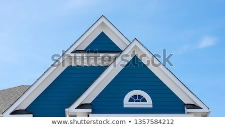 Stock photo: Facade Of A New House With Blue Sky In Background