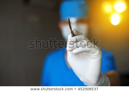 Foto stock: Scalpel In His Hand