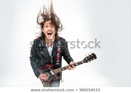 Stock photo: Young Man With An Electric Guitar Isolated
