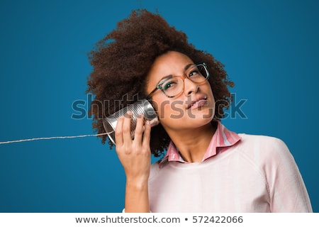 Stockfoto: Girl Listening To Tin Can Phone