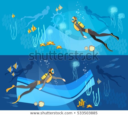 Foto stock: Two People Scuba Diving Under The Sea