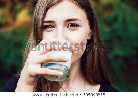 Foto stock: Pretty Woman With Glass Of Milk