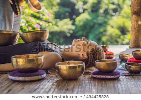 Stock photo: Woman At Wellness Massage With Singing Bowls