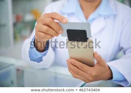 Foto stock: Pharmacist With Card Reader