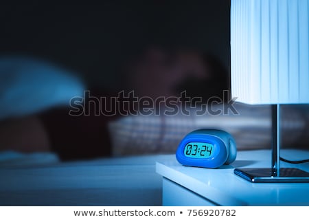 Zdjęcia stock: Alarm Clock On Night Table In Bedroom