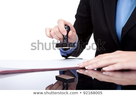 Stock photo: Female Hands Stamping Document In Office