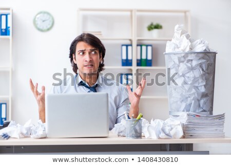 Stockfoto: Businessman Rejecting New Ideas With Lots Of Papers