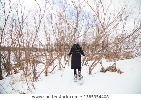 Foto stock: Beautiful Woman On The Blue Sky Of Quebec Winter