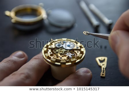 [[stock_photo]]: Senior Repairing Pocket Watch