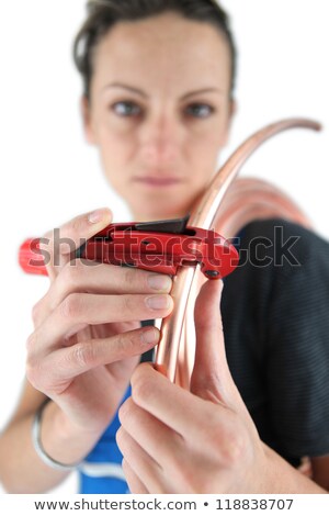 Сток-фото: Female Plumber Cutting Copper Pipe With Special Tool