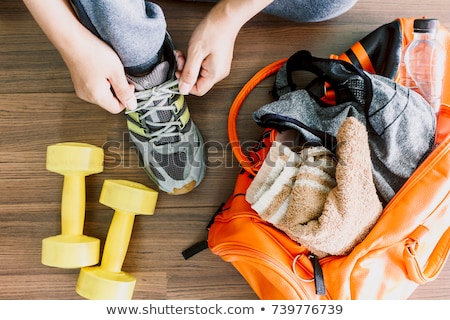 Stock fotó: Man In Gym Clothes Drinking A Bottle Of Water