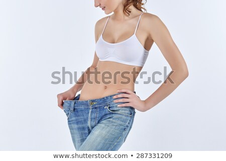 Zdjęcia stock: Woman Became Skinny And Wearing Old Jeans