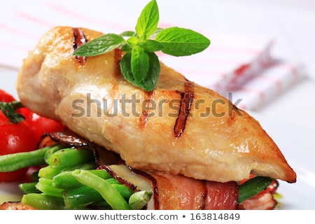 Foto stock: Grilled Chicken Breast With Bacon Wrapped Green Beans