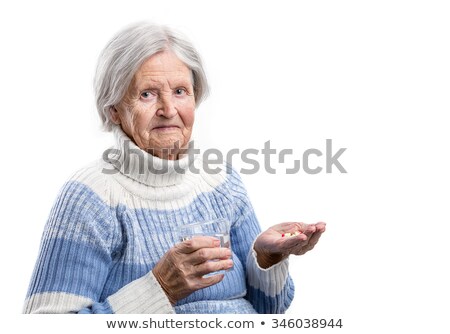 Stock fotó: Senior Woman Taking Her Pills With Water