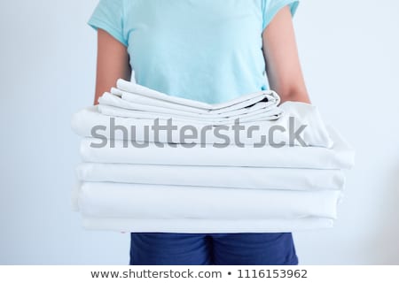 [[stock_photo]]: Cropped Image Of A Hotel Maid Changing Bed Sheet