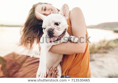 [[stock_photo]]: Woman Petting Dog On Beach