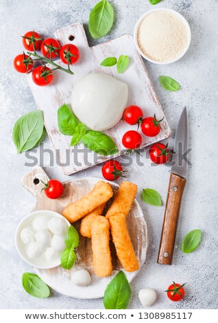 Stock fotó: Fresh Mozzarella Cheese On Vintage Chopping Board With Tomatoes And Basil Leaf And Tray With Cheese