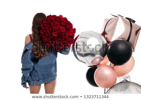 Foto stock: Beautiful Young Brunette Lady In Red With Bunch Of Red Roses On Shoulder