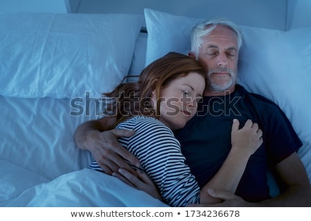 Foto stock: High Angle View Of Man Sleeping On Bed