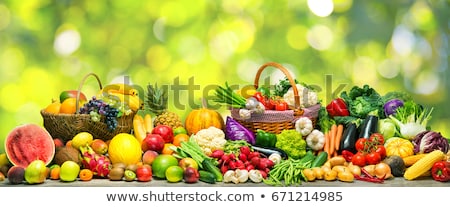 Сток-фото: Basket Of Fresh Vegetables And Fruits On Table