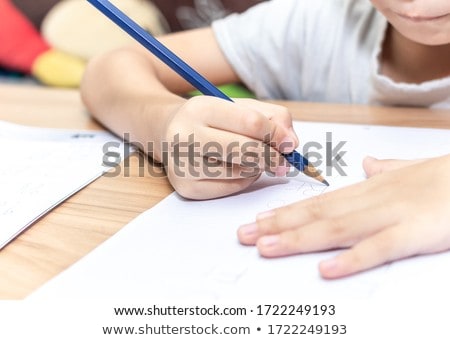 Zdjęcia stock: Close Up Of Little Boy Writing To Notebook At Home