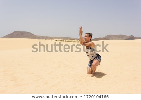 Foto stock: Girl With Horse Posing In The Dunes