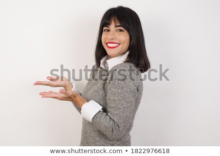 Foto stock: Happy Young Businesswoman In White Shirt Pointing Aside In Isolation