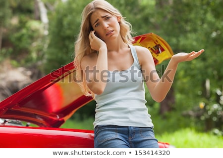 Stockfoto: Young Blond Woman With Her Broken Car