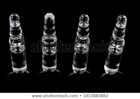 Foto d'archivio: Colorful Vials Isolated On Black Background